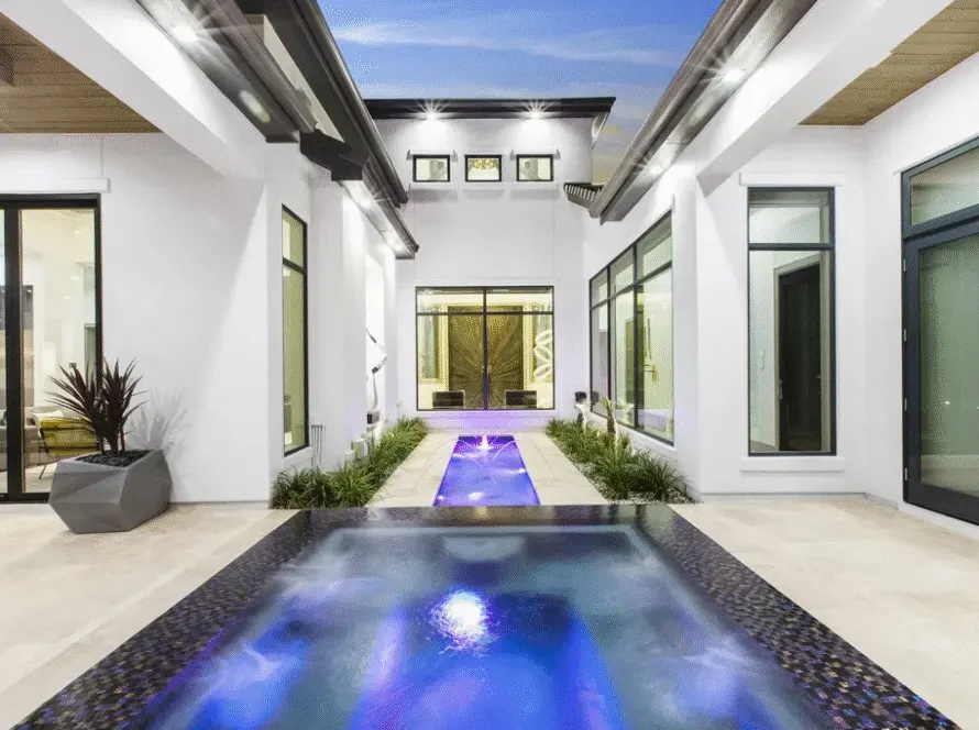 Modern home courtyard with pool by builders in Utah County