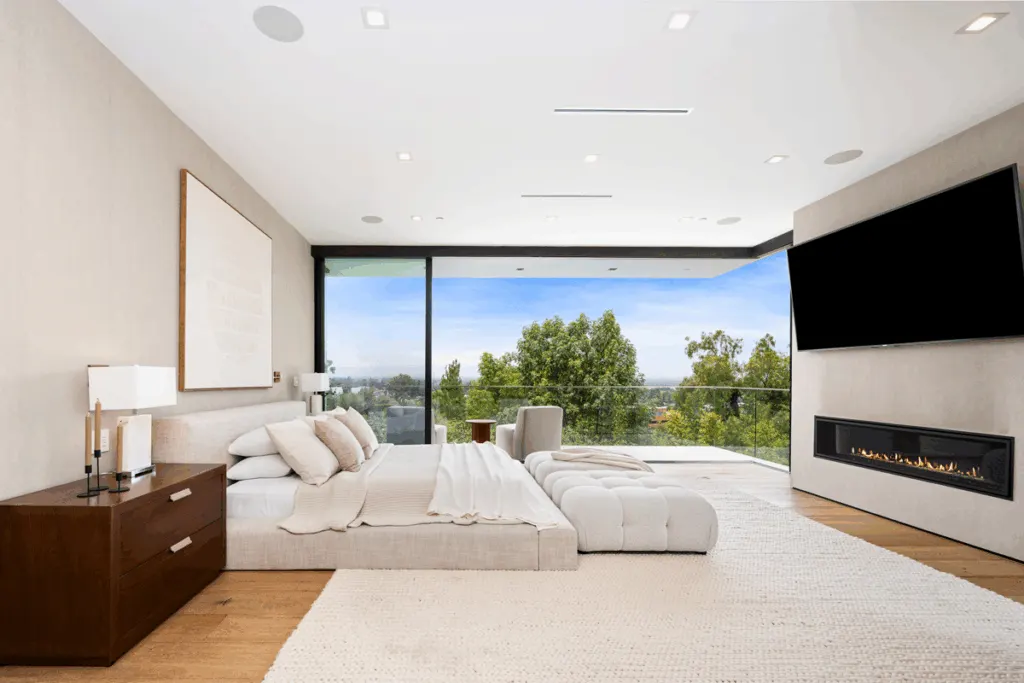 Spacious primary suite in a luxury custom home with mountain views