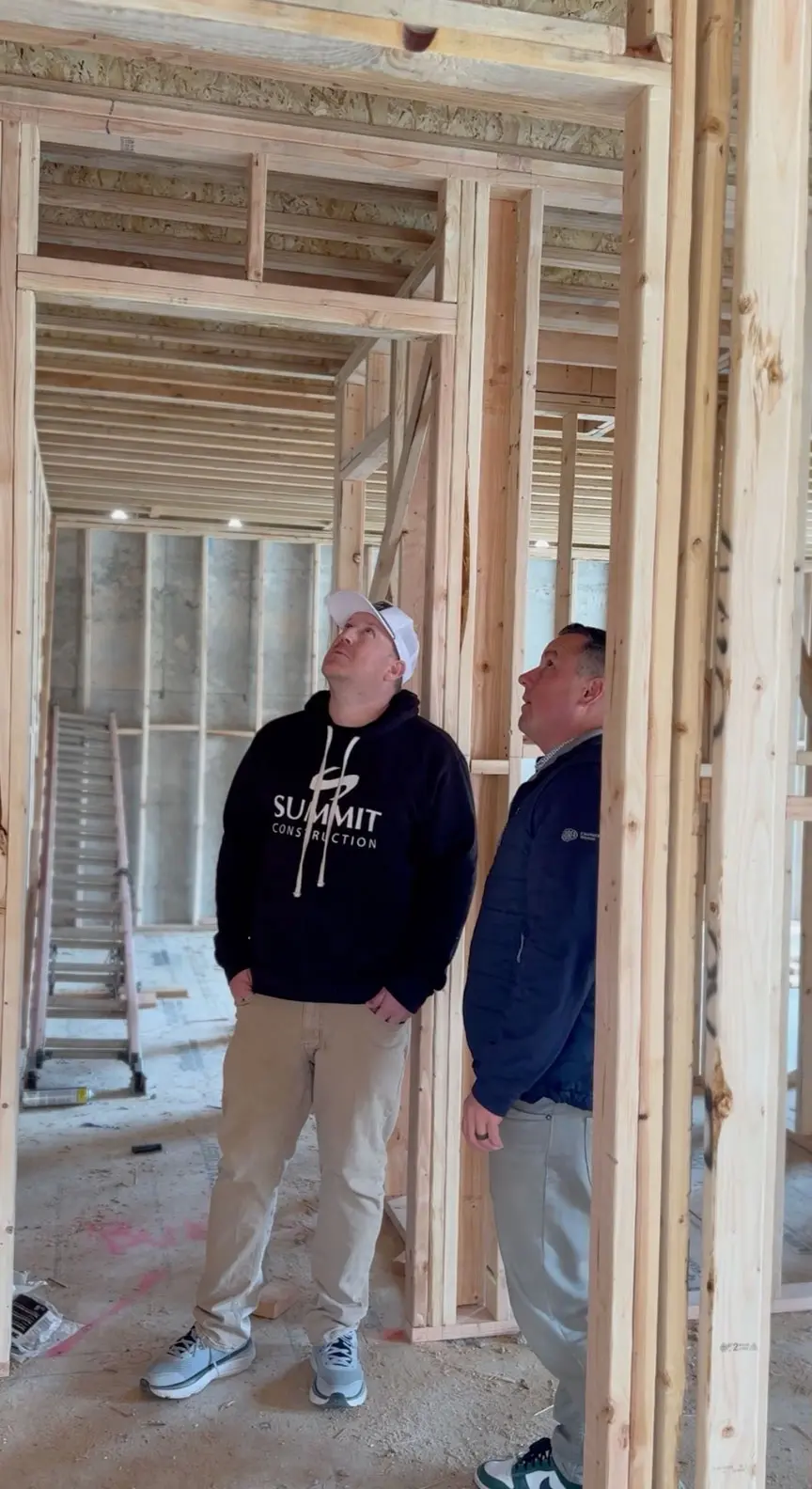 Summit Construction team reviewing custom home building plans and philosophy